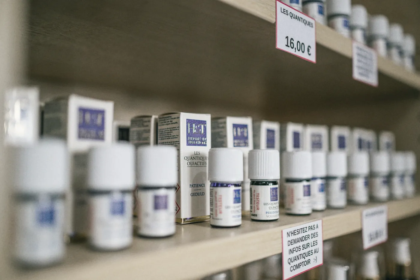Rows of medicine bottles on pharmacy shelves