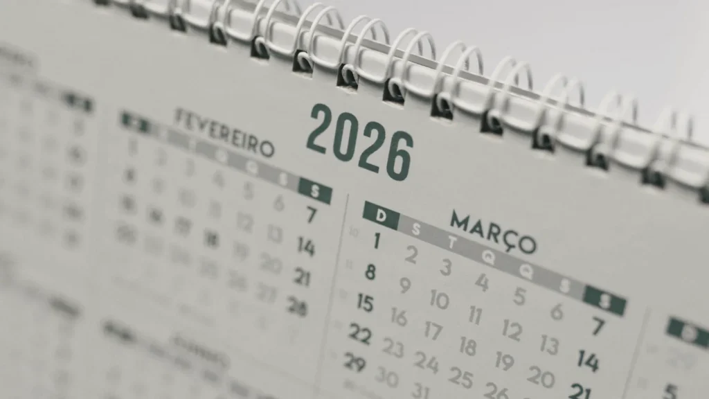 A desk calendar open at the year 2026