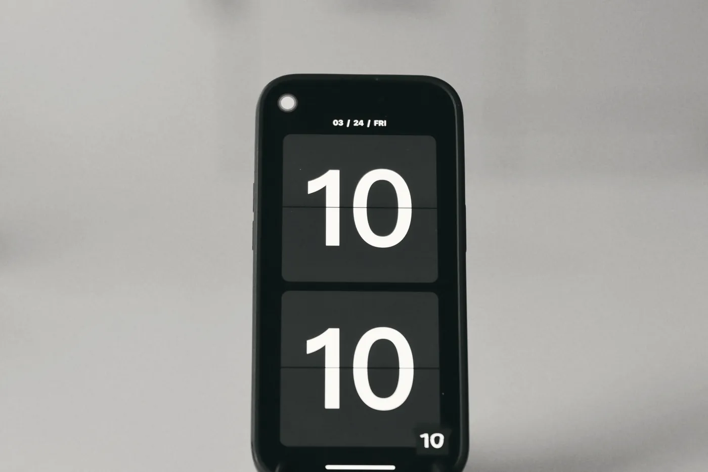 A smartphone screen showing a large digital clock