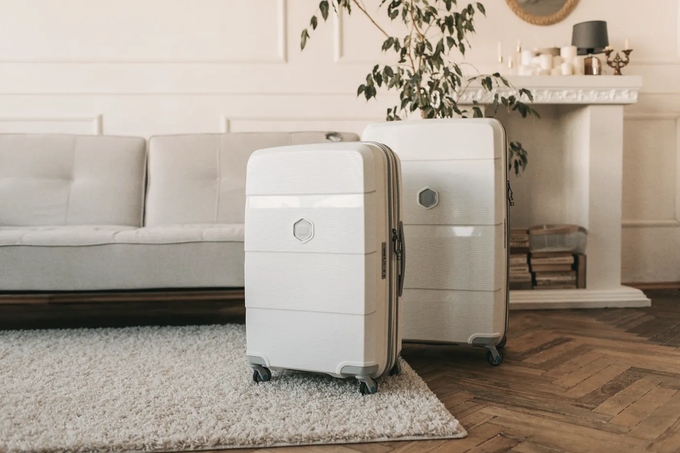 A white suitcase standing in a bright living room
